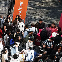 crowd of students and employers at a career fair 