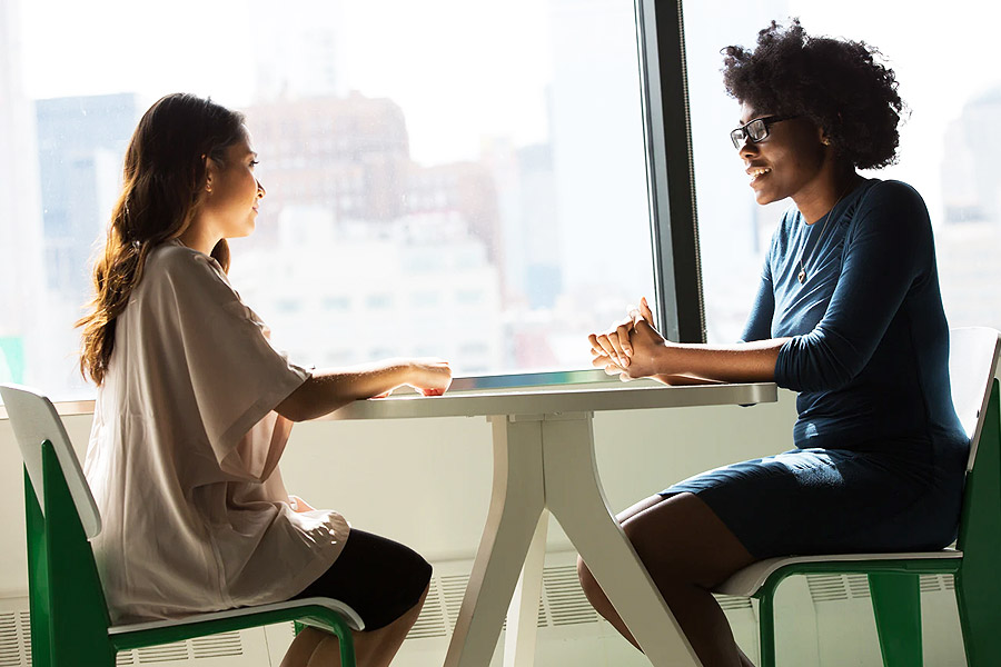 two women having an interview in an office 