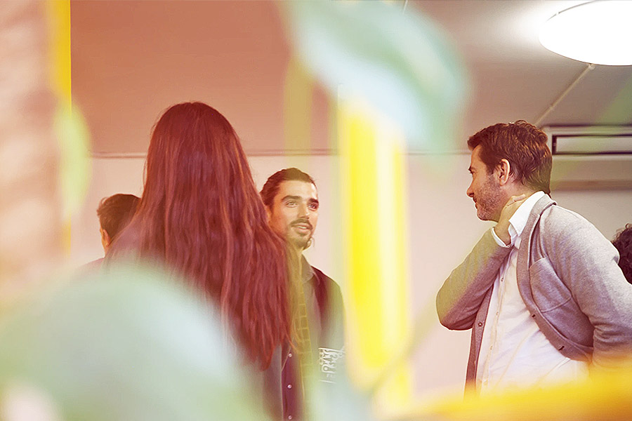 men chatting about employability at a career fair