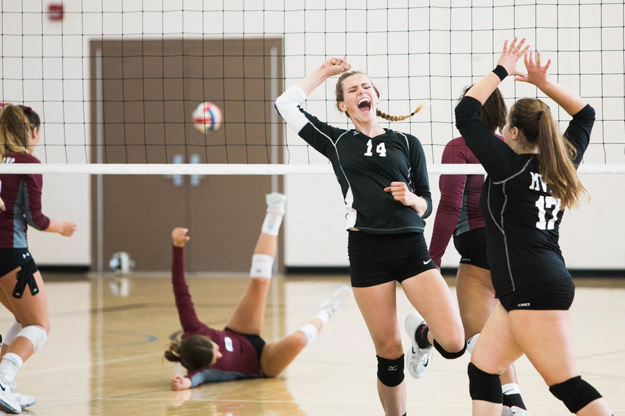 girls playing volleyball